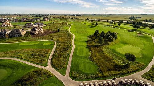 Aerial view of cart path and golf course fairway 