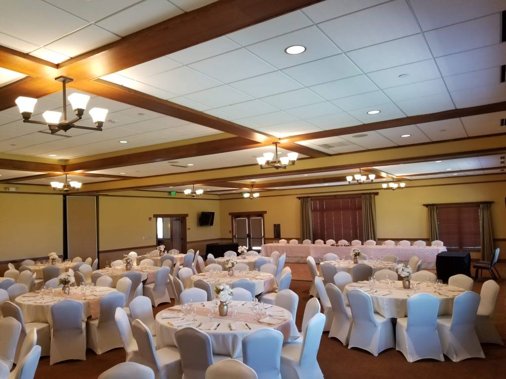 Banquet seating with white and pink decor