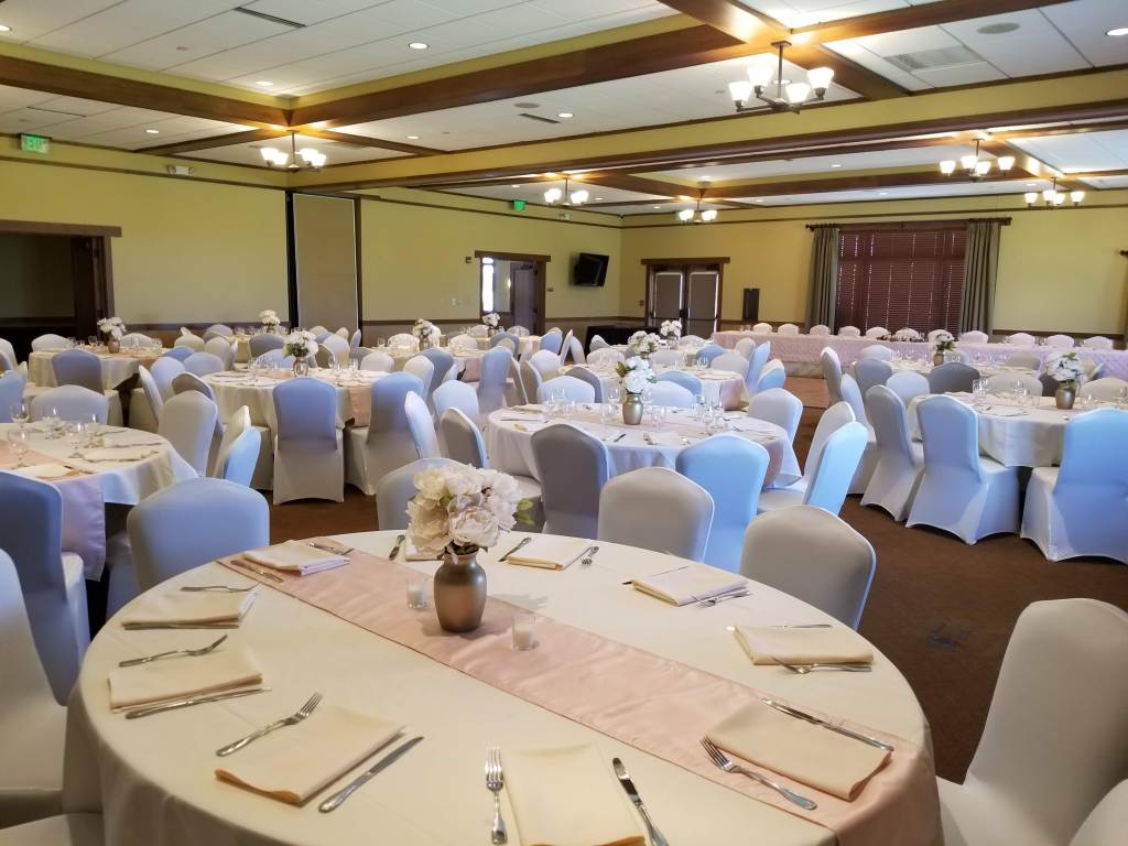 Wedding reception banquet table with flowers and pink decor