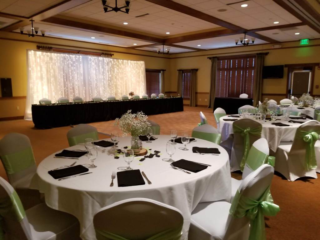 Wedding banquet reception dinner seating with white and light green decor