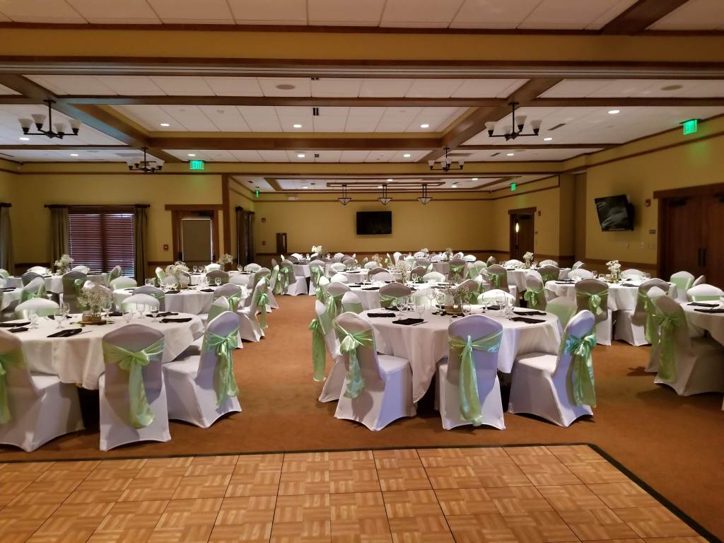 White and green decorated banquet seating